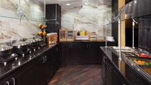 A buffet area with various food items and condiments. - DoubleTree by Hilton El Paso Downtown (El Paso)