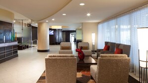 A spacious lobby with a reception desk, seating area with armchairs and sofas, a large window with sheer curtains, and a modern interior design. - DoubleTree by Hilton El Paso Downtown (El Paso)