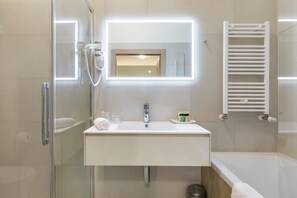 Standard Apartment | Bathroom | Bathtub, deep soaking tub, eco-friendly toiletries, hair dryer