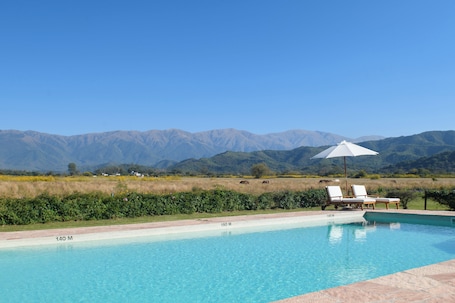 Outdoor pool, pool umbrellas, sun loungers