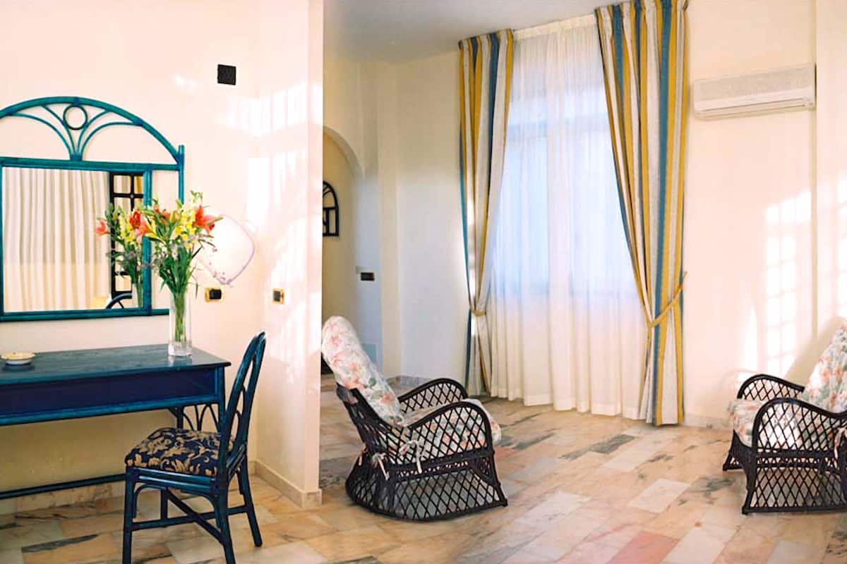 Suite, Balcony, Garden View | Living area | 32-inch LED TV with satellite channels, TV, pay films