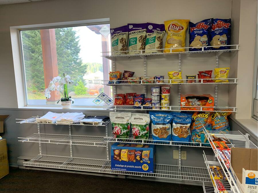 A snack aisle in a store with various chips and snacks.