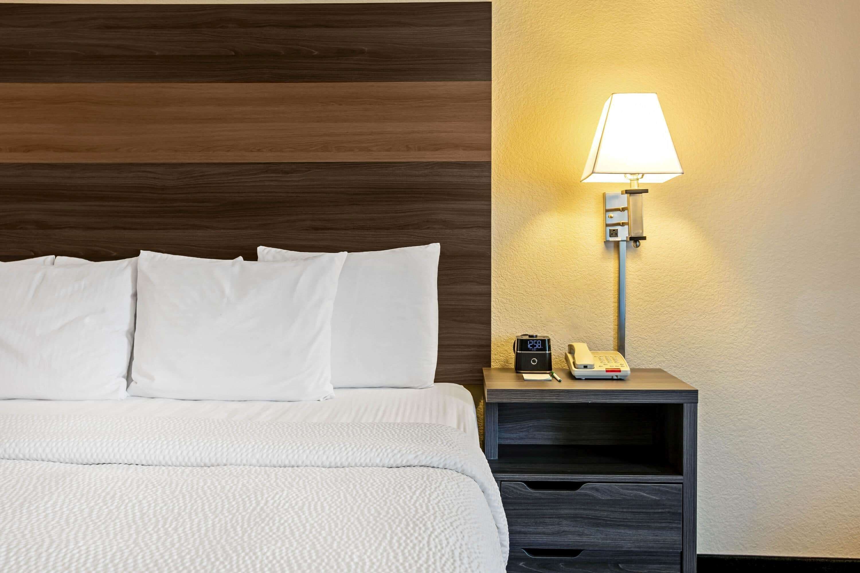 premium bedding, desk, laptop workspace, blackout curtains