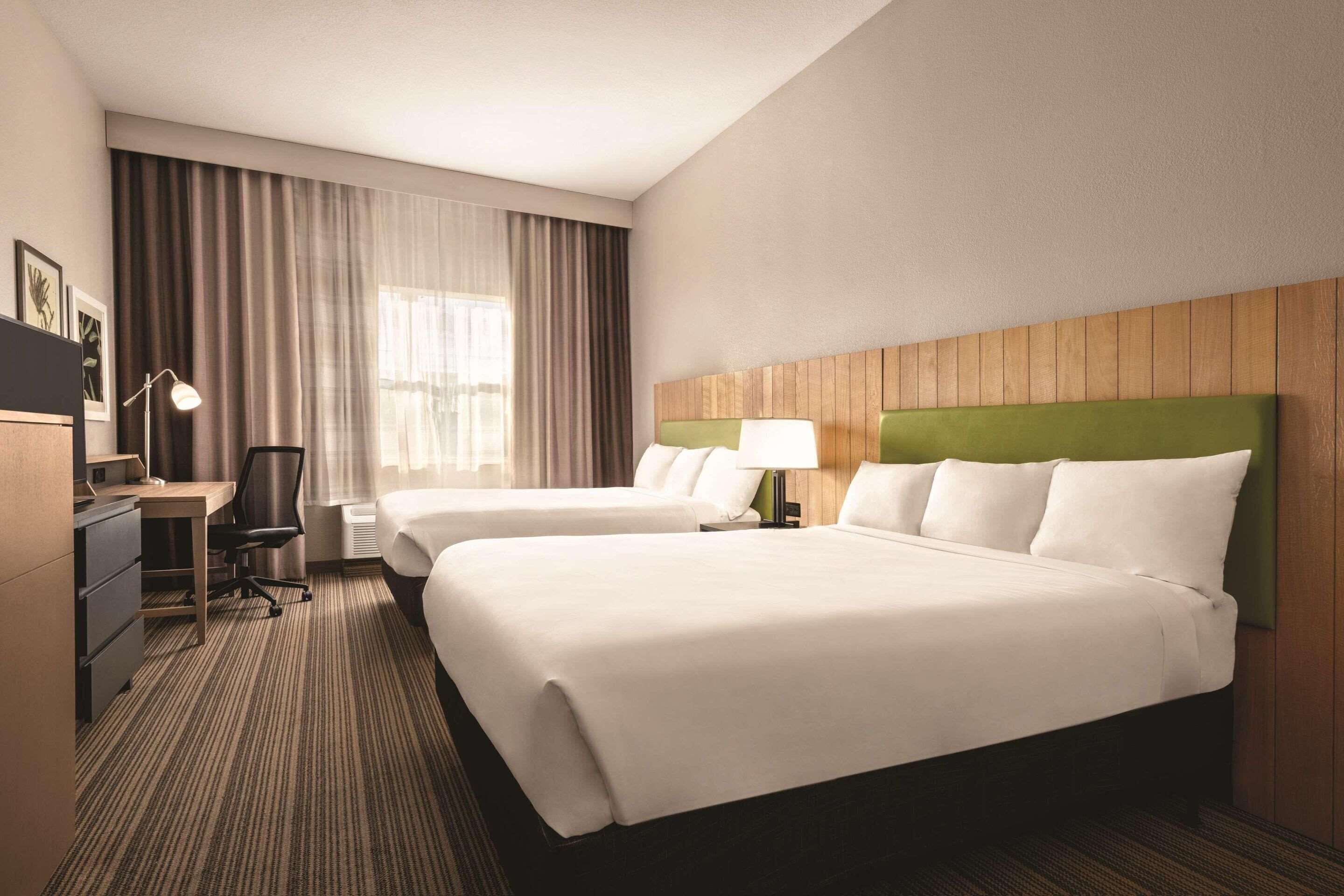 premium bedding, desk, laptop workspace, blackout curtains