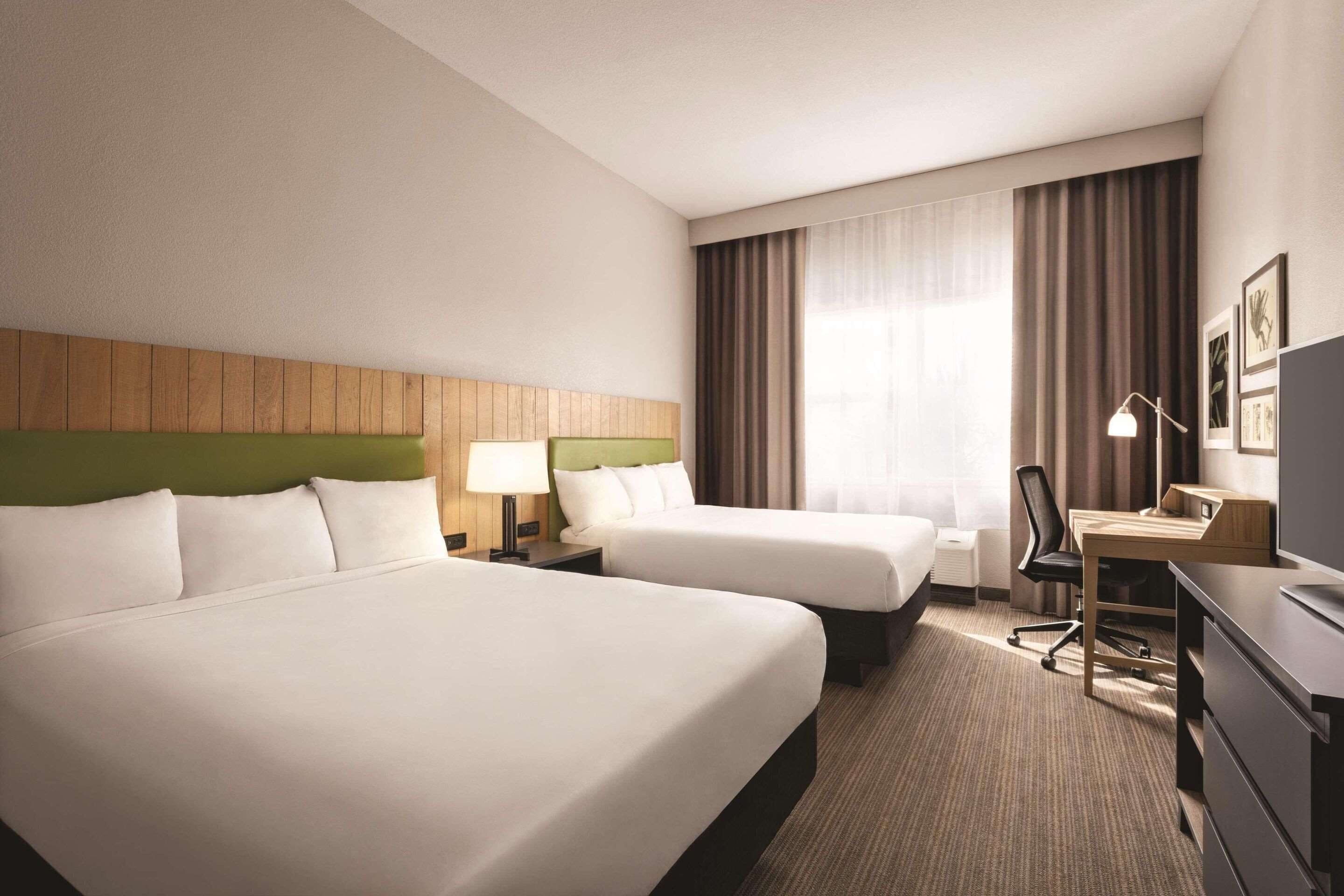 premium bedding, desk, laptop workspace, blackout curtains