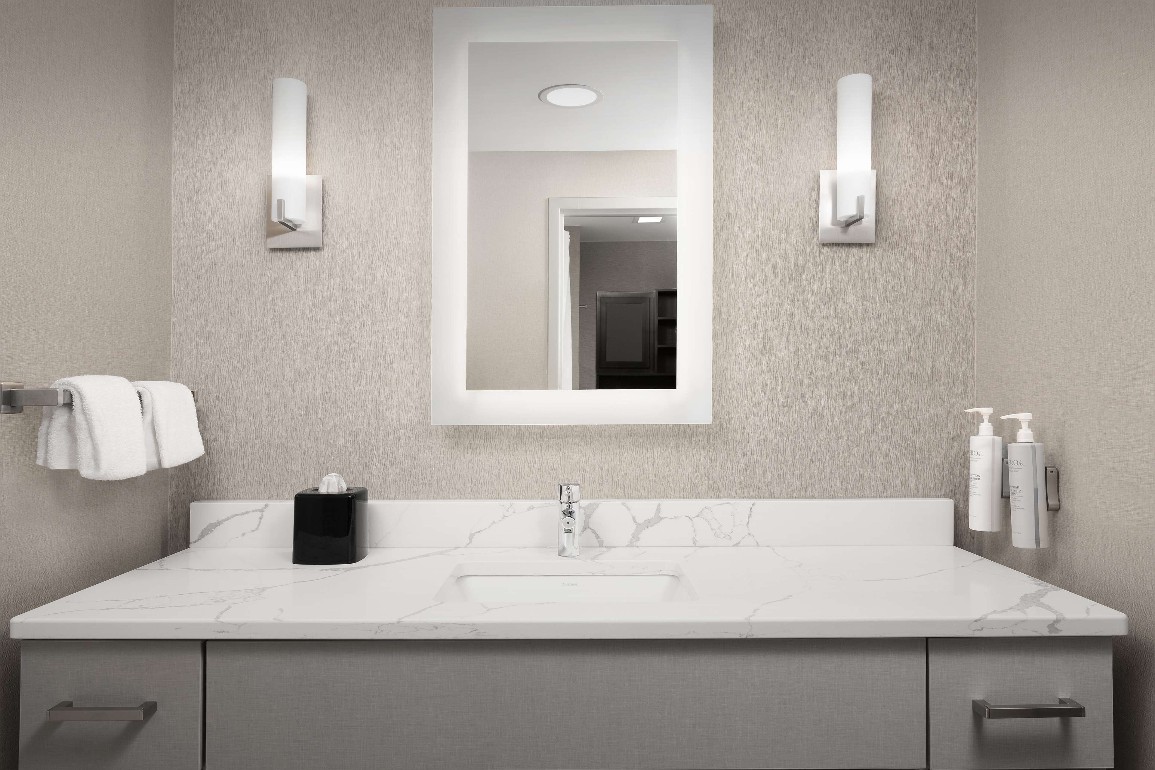 combined shower/bathtub, designer toiletries, hair dryer, towels