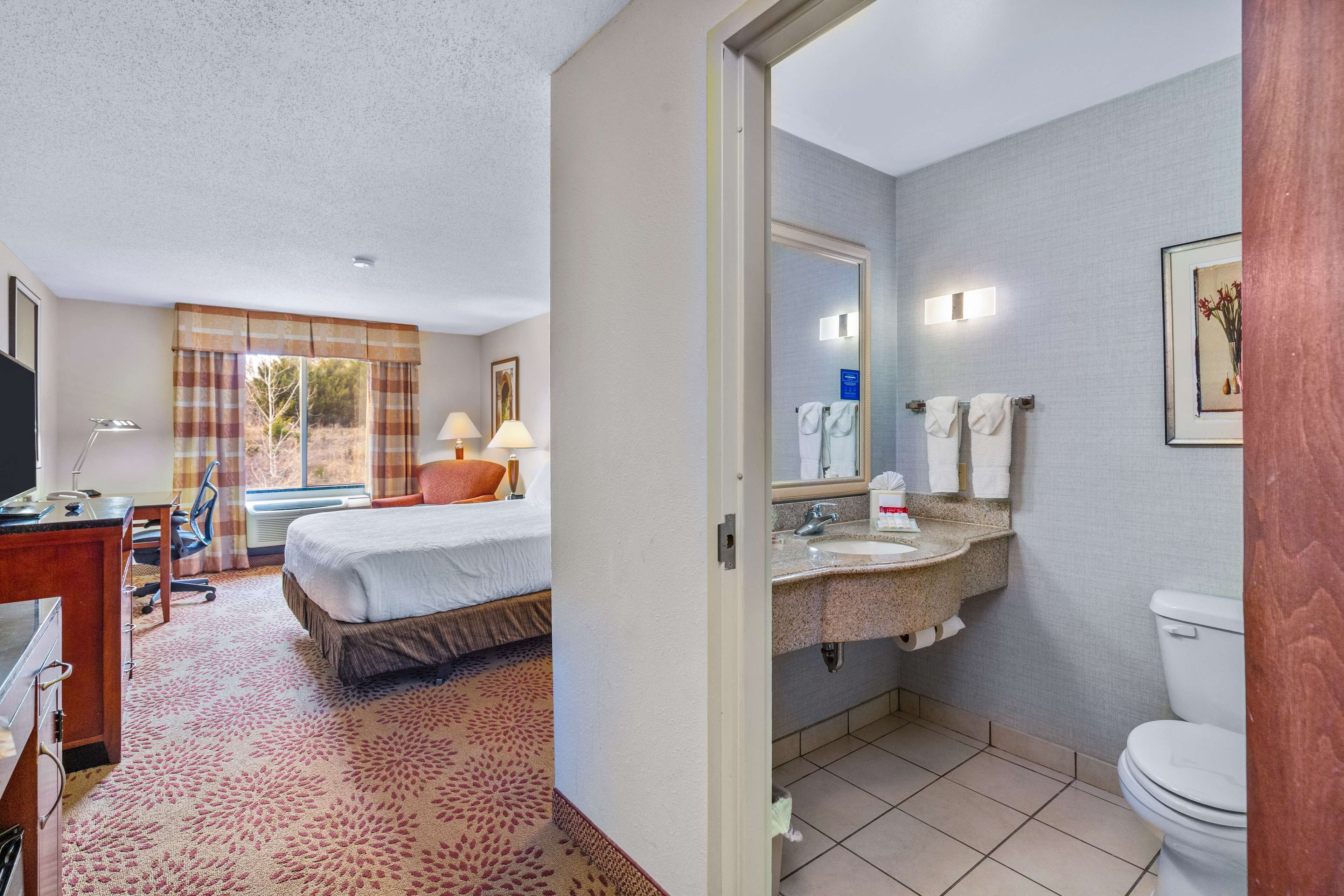 designer toiletries, hair dryer, towels