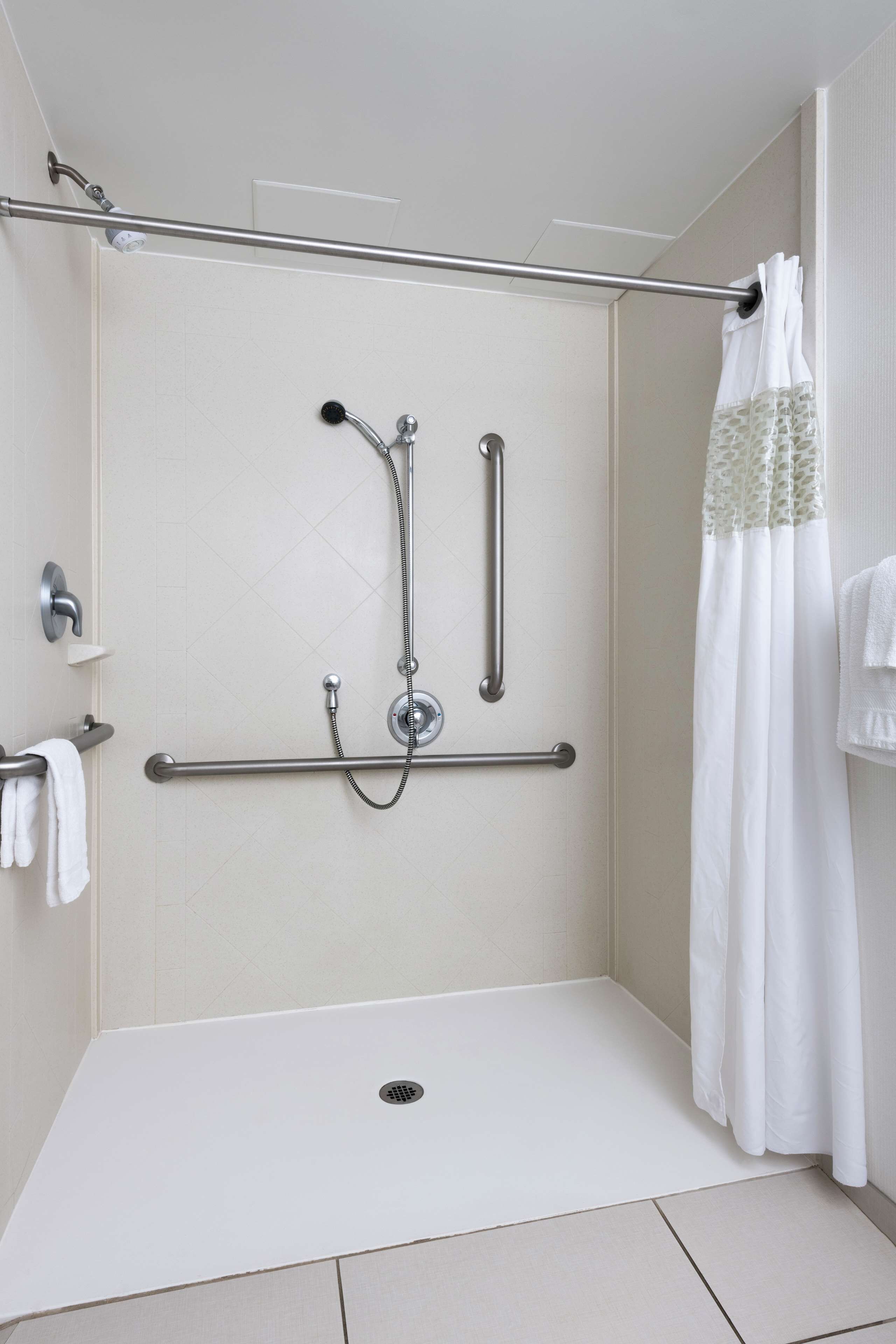 Suite, 1 King Bed, Accessible (Mobility, Roll-in Shower) | Bathroom | Free toiletries, hair dryer, towels, soap