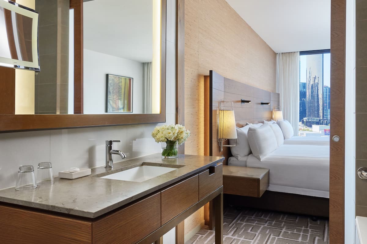 family queen room | bathroom | separate bathtub and shower, deep-soaking bathtub, free toiletries