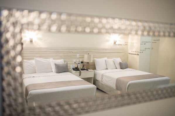 Premium bedding, desk, laptop workspace, blackout drapes