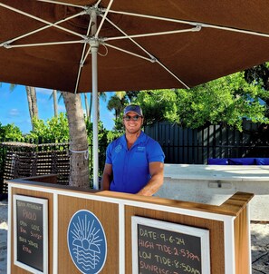 On the beach, white sand, sun loungers, beach umbrellas