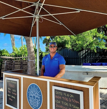 On the beach, white sand, sun loungers, beach umbrellas at Vanderbilt Beach Resort