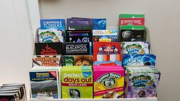A display of travel brochures and guides for various destinations.