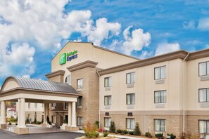 A Holiday Inn Express hotel with a covered entrance and multiple windows. - Holiday Inn Express Troutville by IHG (Troutville)