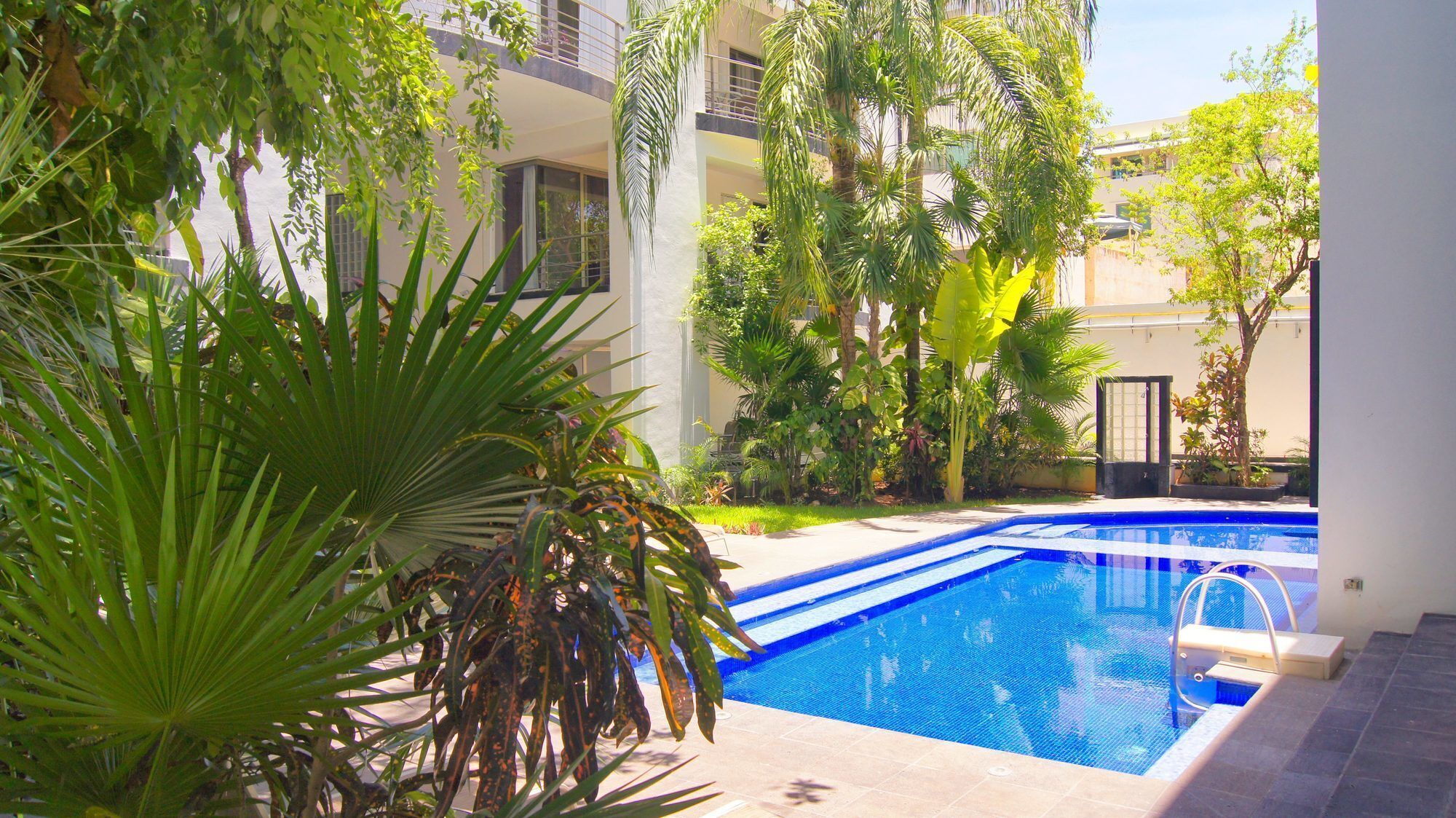 2 outdoor pools, open 9 AM to 10:00 PM, pool loungers