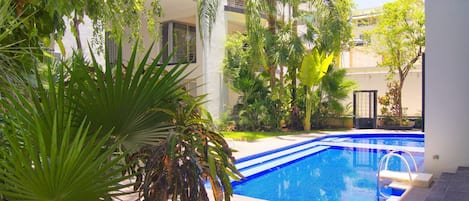 2 outdoor pools, open 9 AM to 10:00 PM, pool loungers