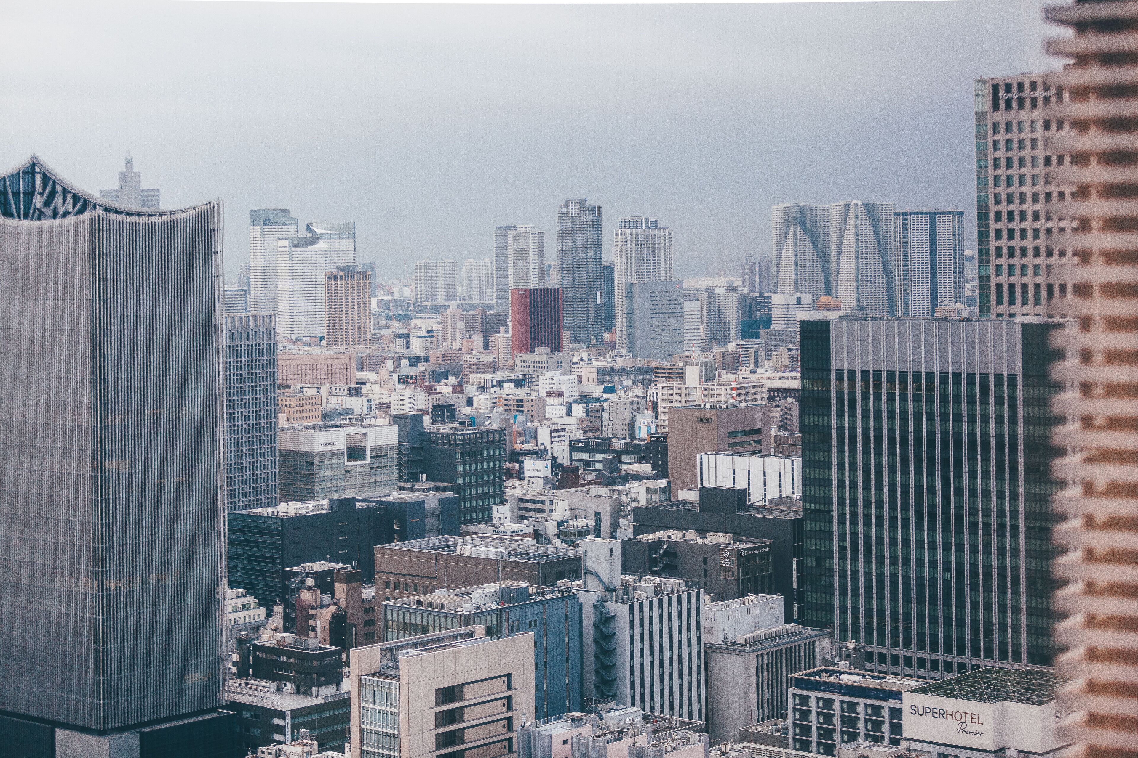 A cityscape with a SuperHotel building.