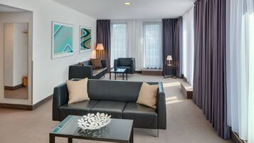 Executive Suite | Living room | 26-inch flat-screen TV with satellite channels, TV