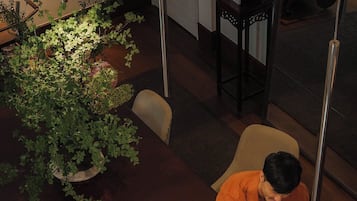 Guests can enjoy games and socialize around the table in this stylish room.