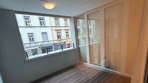 A balcony with a view of a building labeled 'MIA 1510.'