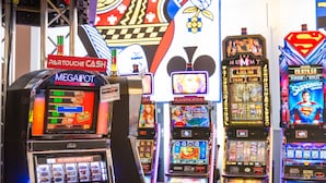 A casino with slot machines and bar-style seating. - Hotel des Palmiers (Hyères)