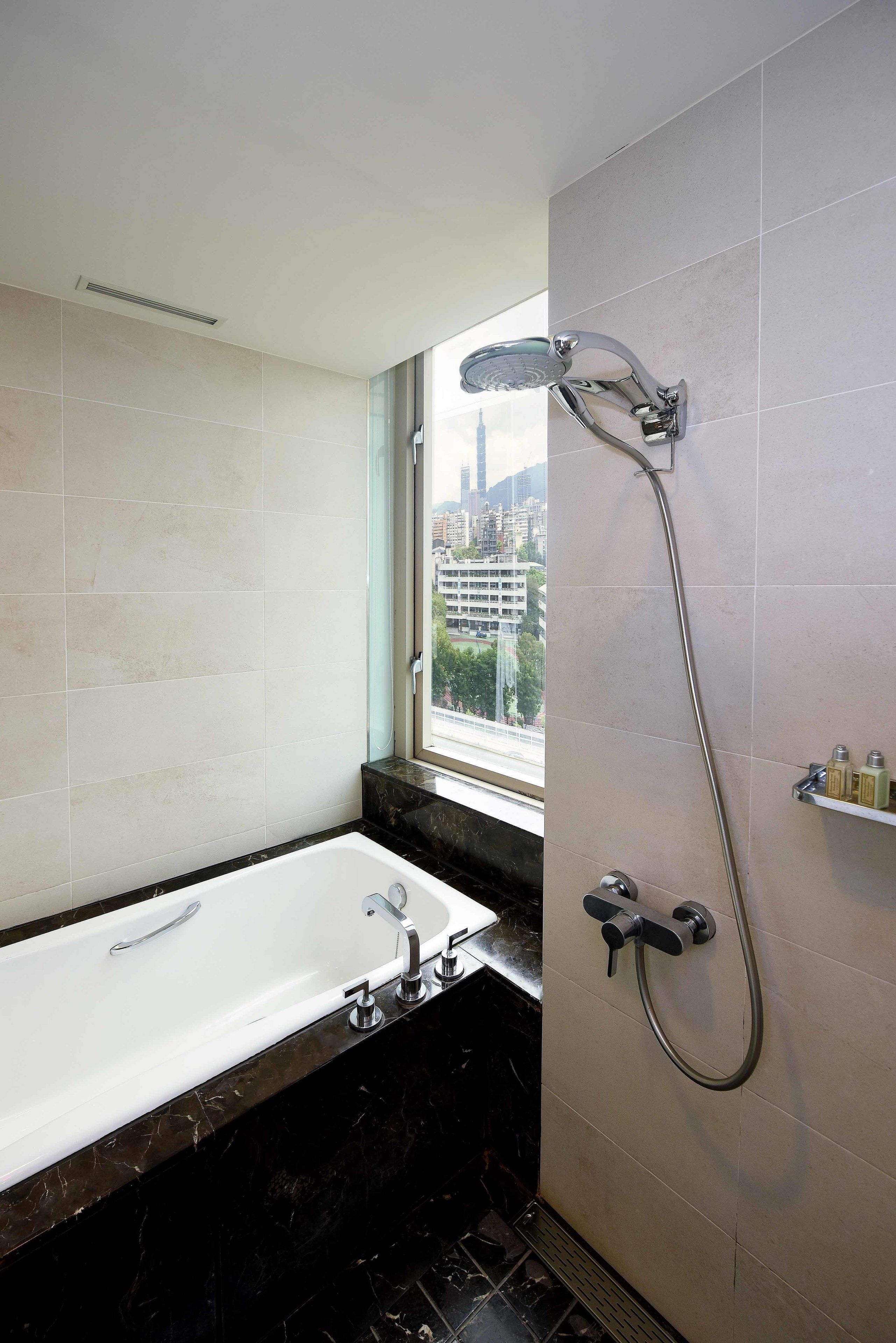 separate bathtub and shower, free toiletries, hair dryer, slippers