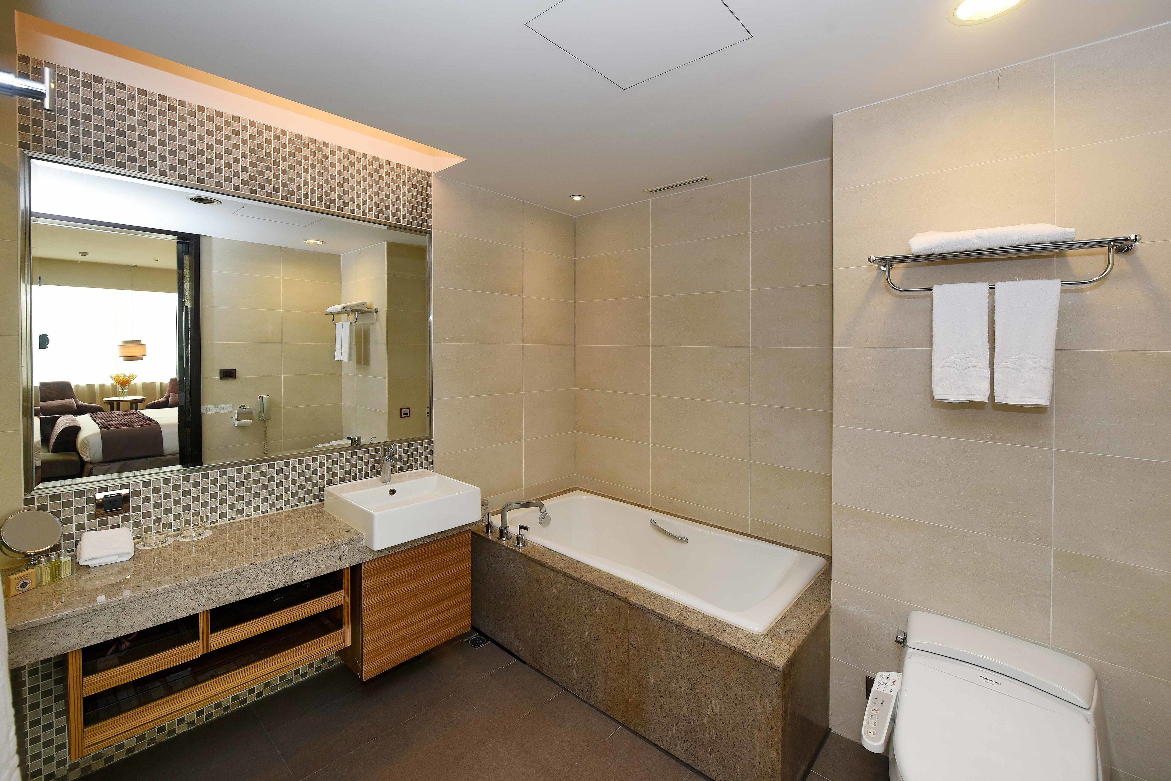 separate bathtub and shower, free toiletries, hair dryer, slippers