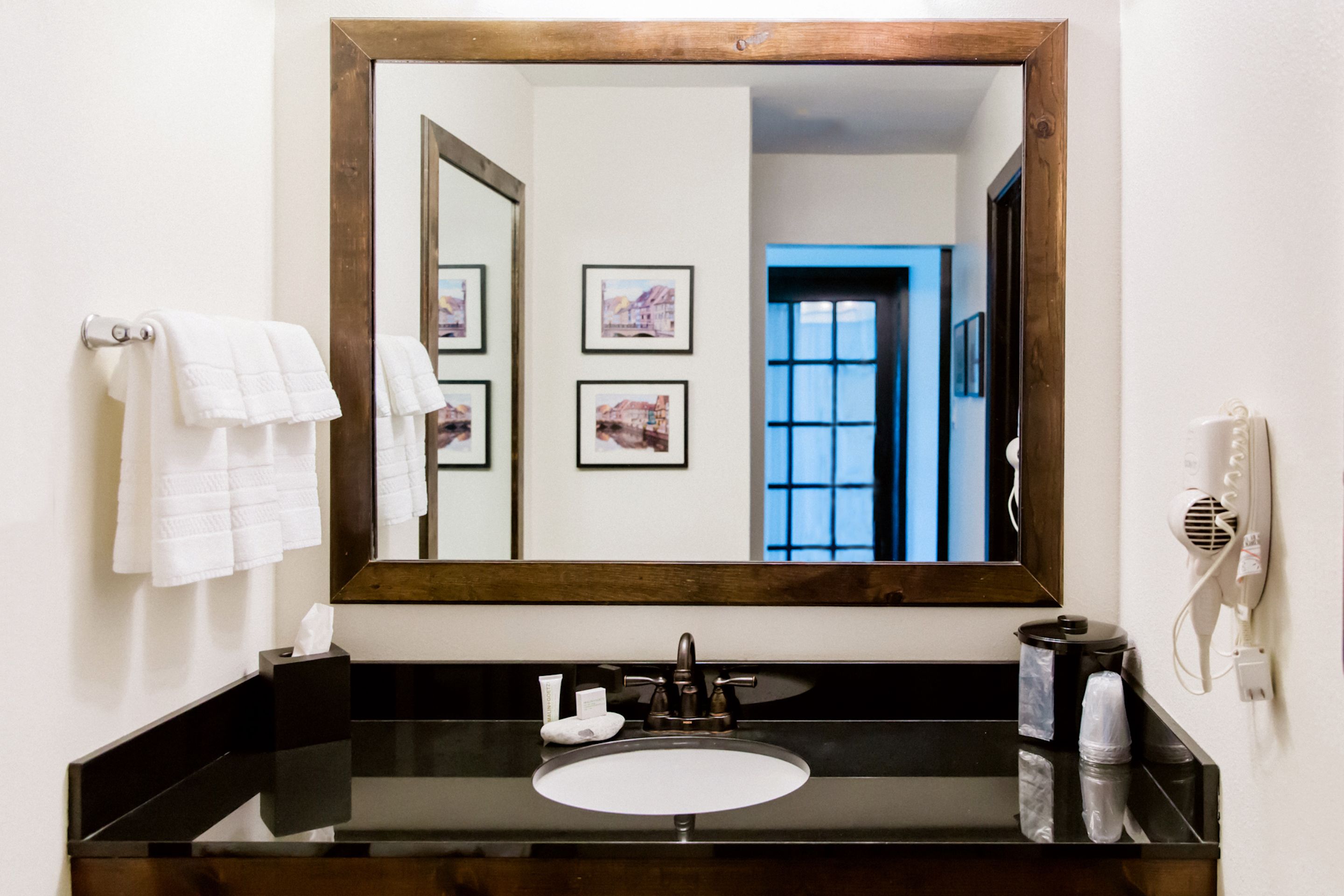 combined shower/bathtub, designer toiletries, hair dryer, towels