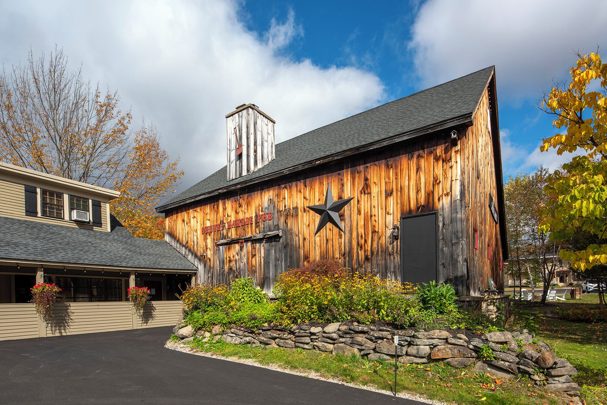 A rustic wooden building with a sign reading "SHILOH HANNALE PUB."