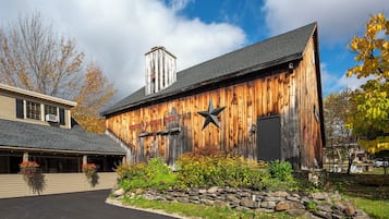 A rustic wooden building with a sign reading "SHILOH HANNALE PUB."