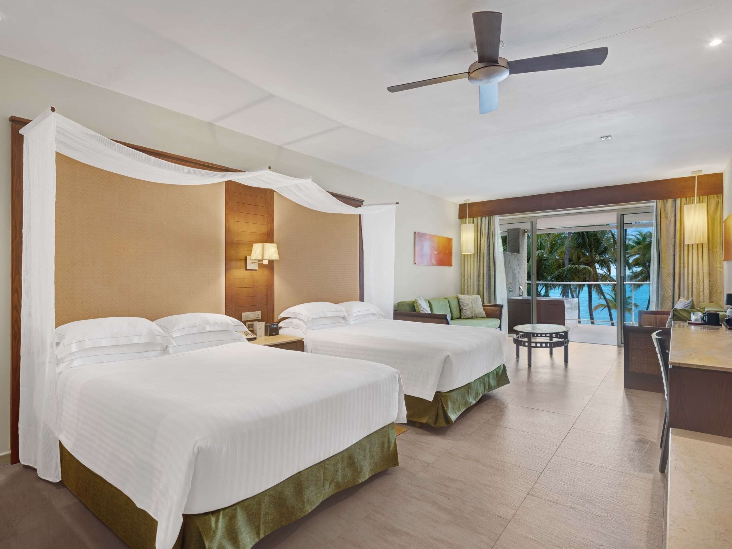 Suite junior, vista al mar (Premium Level) | Ropa de cama de alta calidad y minibar 