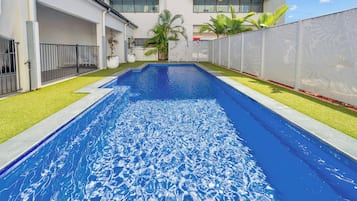 Outdoor pool, open 6:00 AM to 10:00 PM, pool loungers