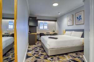 Deluxe Queen Room | Pillowtop beds, in-room safe, desk, blackout drapes