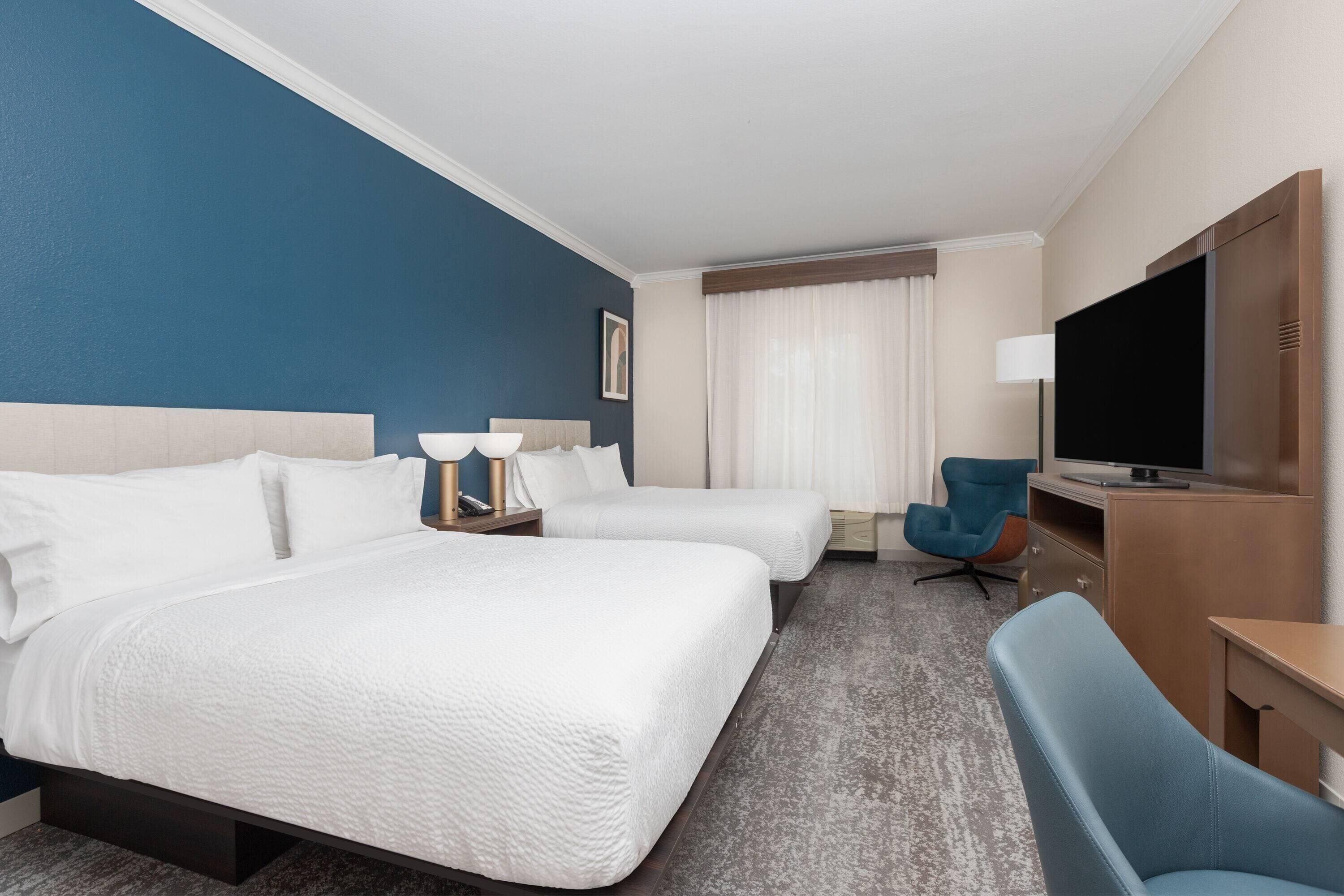 Premium bedding, down duvets, desk, laptop workspace