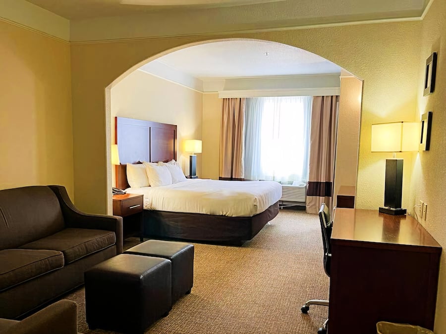 Desk, laptop workspace, blackout drapes, iron/ironing board