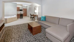 A modern hotel room with a living area, kitchenette, and a bathroom. - La Quinta Inn & Suites by Wyndham Oklahoma City -Yukon (Yukon)