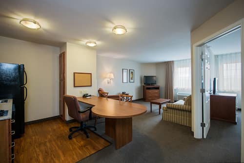 Suite, 1 Bedroom | Desk, laptop workspace, blackout drapes, iron/ironing board