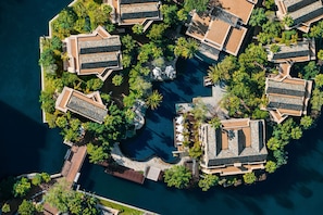 An aerial view of a resort with multiple buildings, a central pool, and surrounding greenery. - One&Only Cape Town (Cape Town)