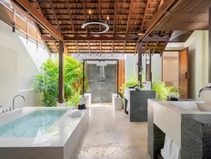A spa area with a large bathtub, two sinks, a shower, and a wooden ceiling. - SALA Samui Choengmon Beach (Koh Samui)