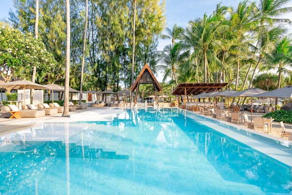 2 outdoor pools, open 7:00 AM to 6:00 PM, pool umbrellas, pool loungers