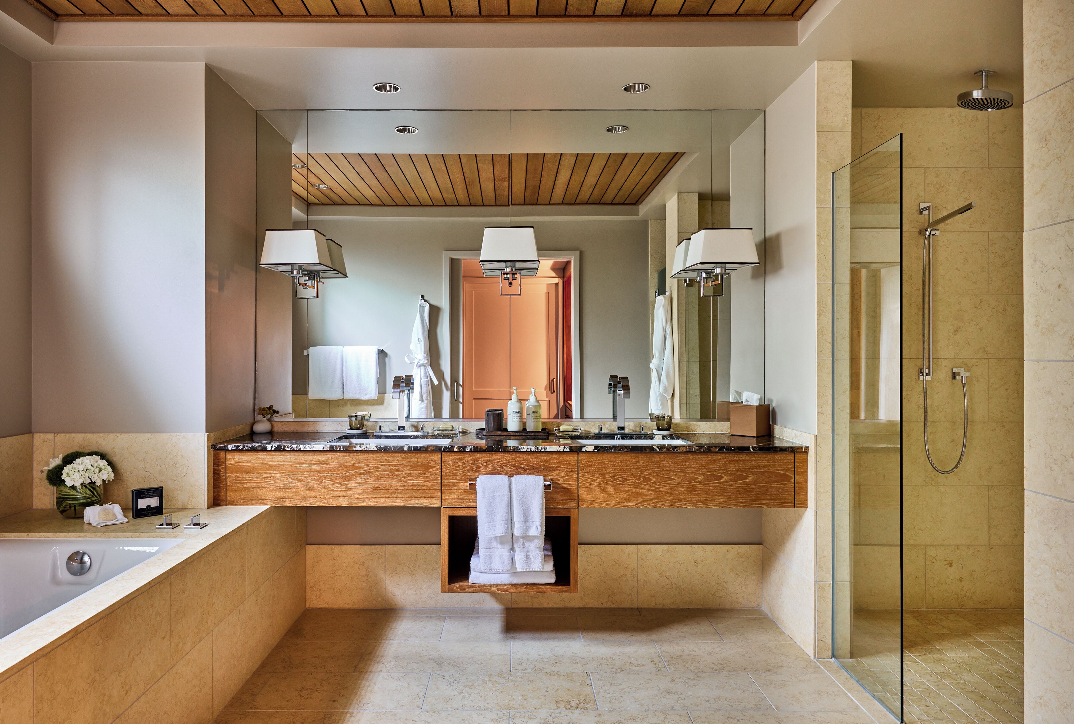 Separate tub and shower, designer toiletries, hair dryer, bathrobes