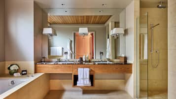 Separate tub and shower, designer toiletries, hair dryer, bathrobes