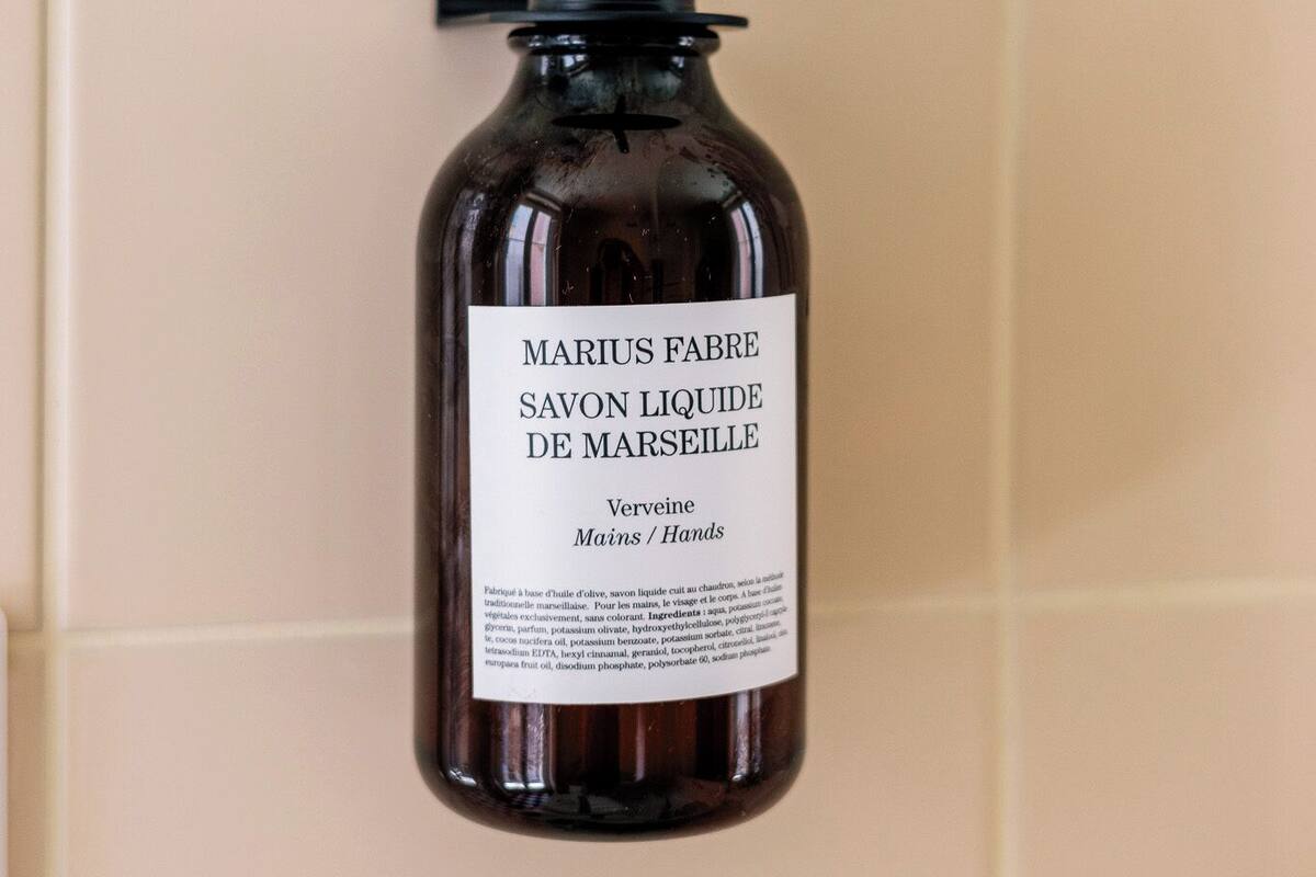 designer toiletries, hair dryer, towels, shampoo