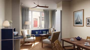 Chambre familiale La Maison | Coin séjour | Télévision à écran plat de 43 pouces avec chaßnes par cùble