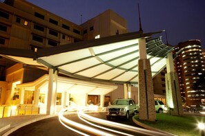 Welcome to our hotel, featuring a modern architectural design with a flat roof and adjacent balconies.
