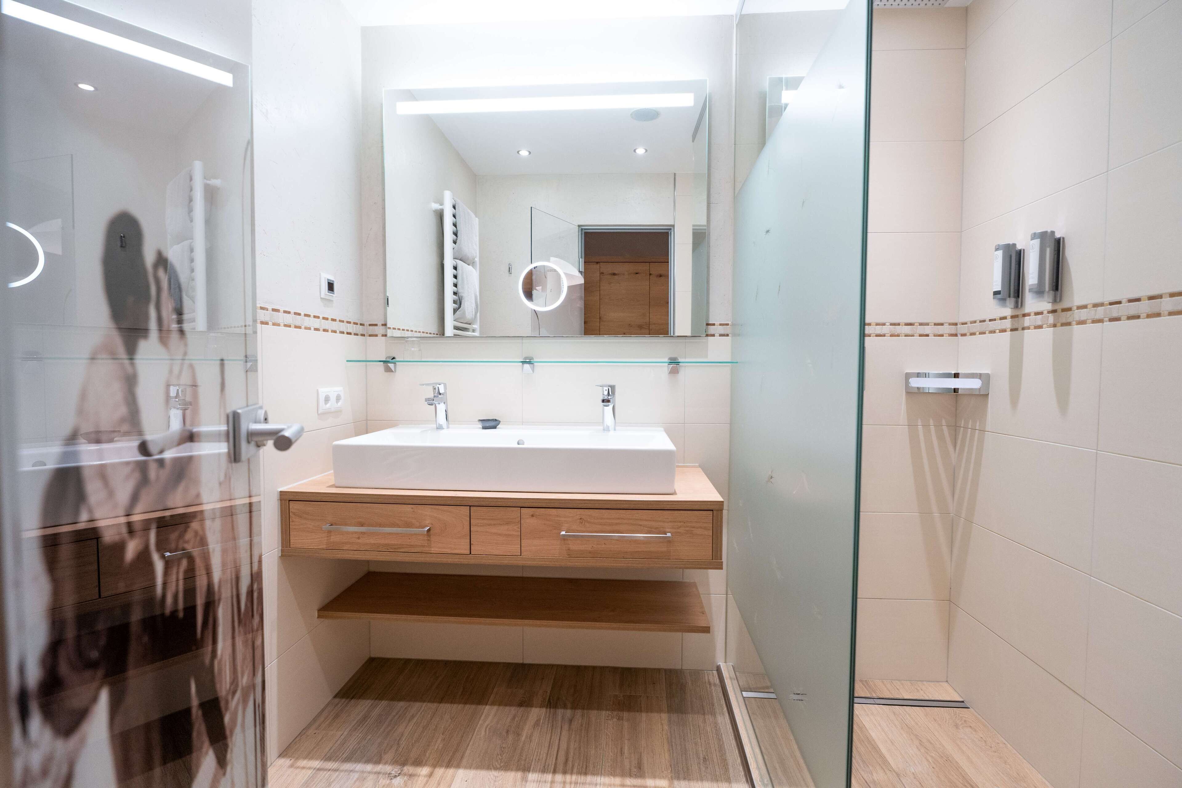 shower, hair dryer, bathrobes, slippers