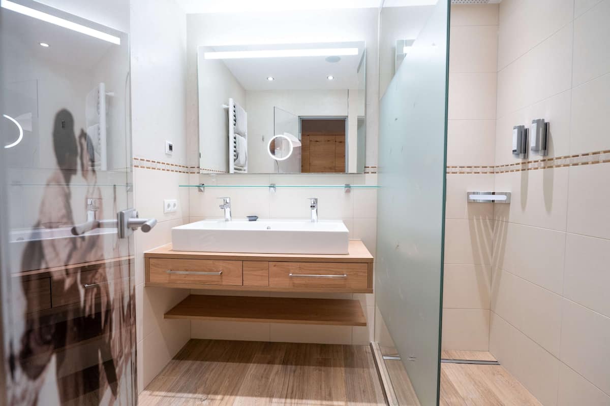 shower, hair dryer, bathrobes, slippers