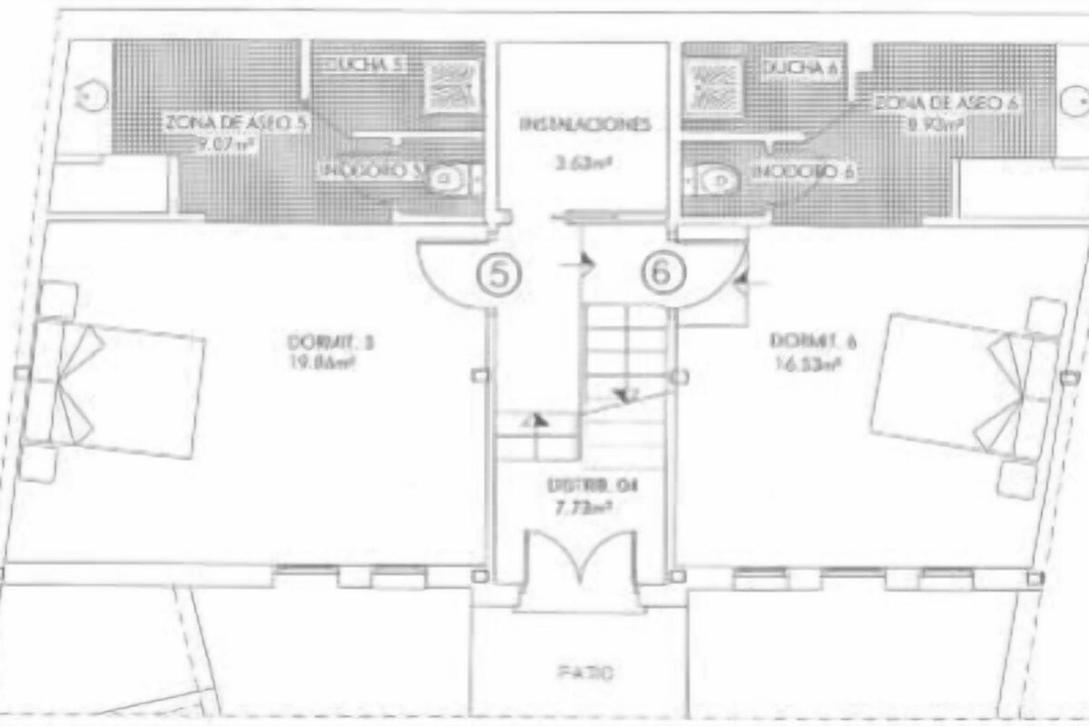 A hotel floor plan with two bedrooms, a living room, a kitchen, and a bathroom.
