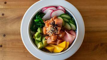 A bowl of food with various ingredients.