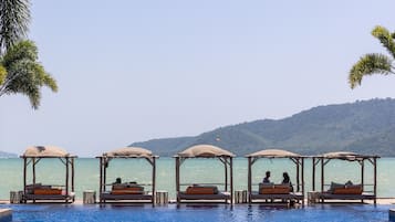 On the beach, sun-loungers, kayaking